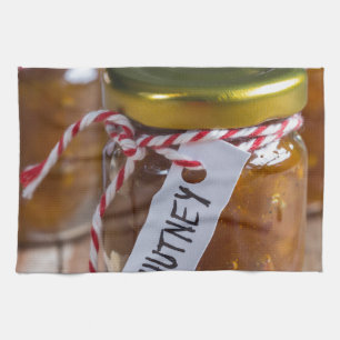 Onion pineapple chutney on rustic wood kitchen towel