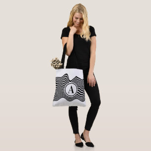Op art with black and white wavy lines and letter tote bag