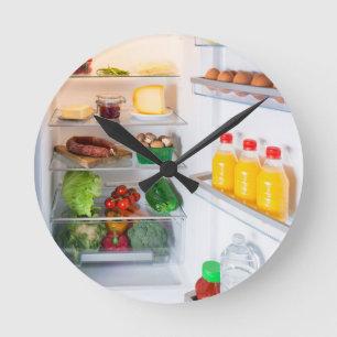 Open fridge filled with food round clock