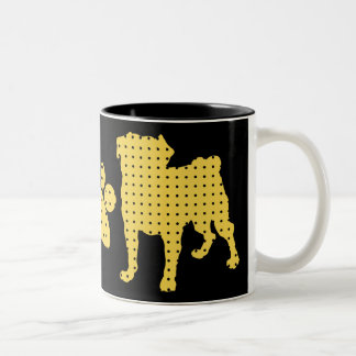 Or et tasses noires de carlin et de patte