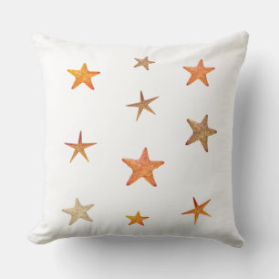 Orange and beige sea stars on white throw pillow