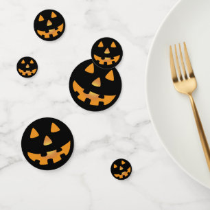 orange and black jack o' lantern face confetti