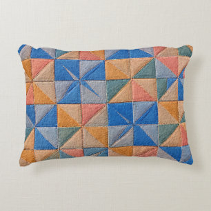 orange and blue quilt accent pillow