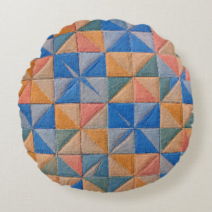 orange and blue quilt round pillow
