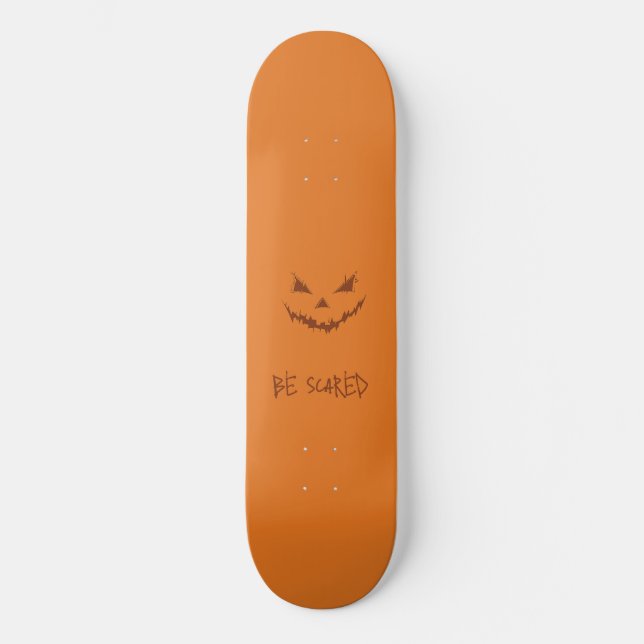 Orange and Scary Carved Pumpkin Face Skateboard (Front)