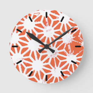 Orange and white geometric pattern round clock