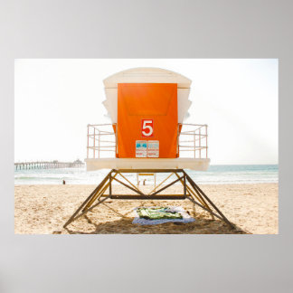 Orange and white shed in front of shore poster