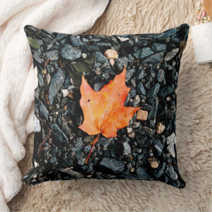 Orange Autumn Leaf on Black Rocks Throw Pillow