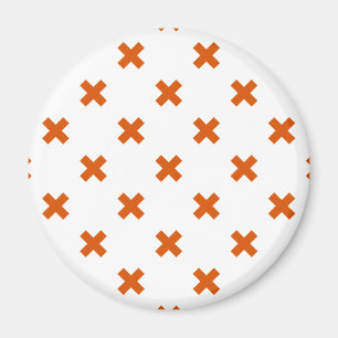 Orange cross stitches on white magnet