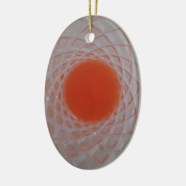 Orange drink inside a crystal glass ceramic ornament (Left)