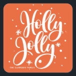 Orange Festive Holly Jolly Hand Lettered Holiday Square Sticker<br><div class="desc">Orange Festive Holly Jolly Hand Lettered Holiday Sticker | Customizable holiday sticker featuring hand-lettered "holly jolly" overlay with snow and snowflakes accent. Customize by adding your own texts. This will be perfect for Christmas invitations,  cards,  gifts and party favours. Matching items are available.</div>