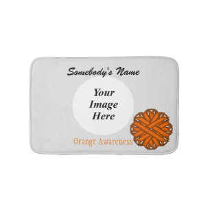 Orange Flower Ribbon Tmpl by Kenneth Yoncich Bath Mat