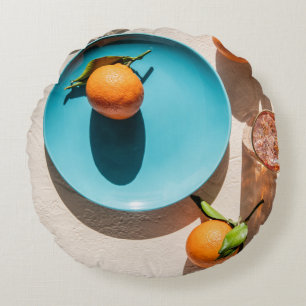 Orange fruit on plate round pillow