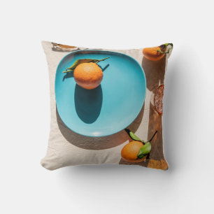Orange fruit on plate throw pillow