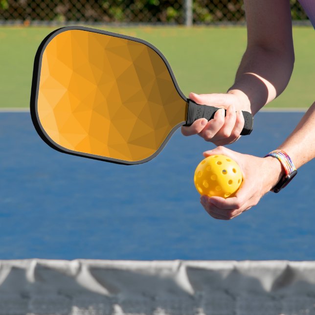 Orange gradient geometric mesh pattern pickleball paddle (Insitu)