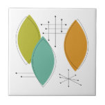 Orange Green Tuquoise Surfboard Shapes Mid Century Tile<br><div class="desc">This funky mid century modern ceramic tile,  with it's turquoise,  green,  and orange ornament shapes and black starbursts,  will add a splash of colour to your tiling project or as an accent piece.</div>