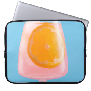 Orange juice in clear drinking glass laptop sleeve