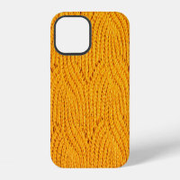 Orange knitted sweater, textured background.