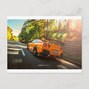 Orange Nissan GT-R Ripping through Seattle streets Postcard