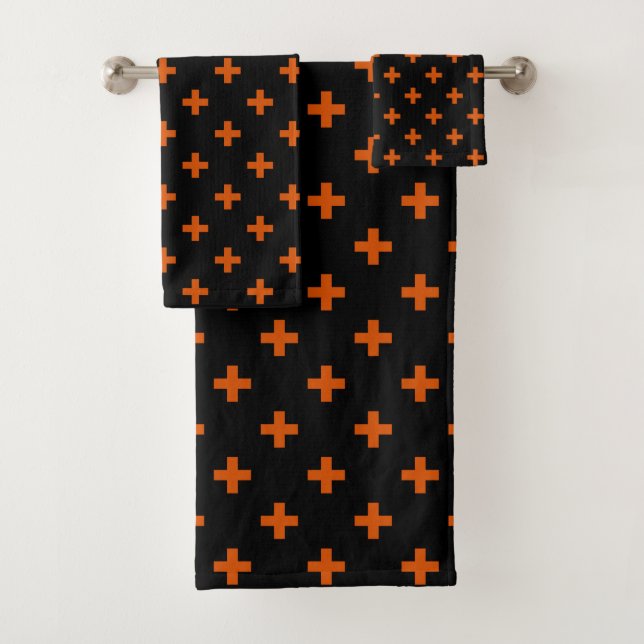 Orange polka crosses on black bath towel set (Insitu)