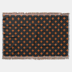 Orange polka crosses on black throw blanket