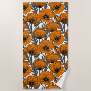Orange poppies on white beach towel