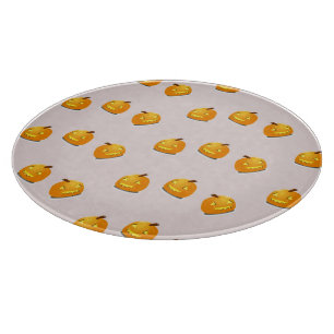 Orange pumpkin head pattern cutting board