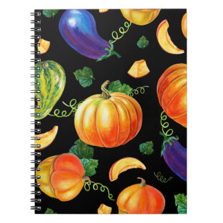 Orange pumpkin, Striped zucchini, blue eggplant on Notebook