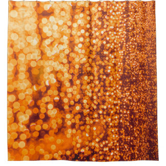 Orange raindrops on glass, abstract background.