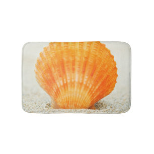 Orange Scallop Shell Standing Upright In Sand Bath Mat