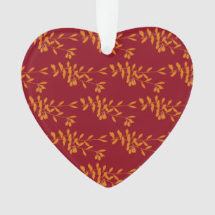 Orange silhouette branch leaves on red ornament
