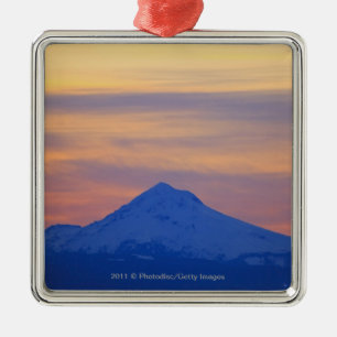 Orange Sky Snow Capped Blue Mountain Metal Ornament