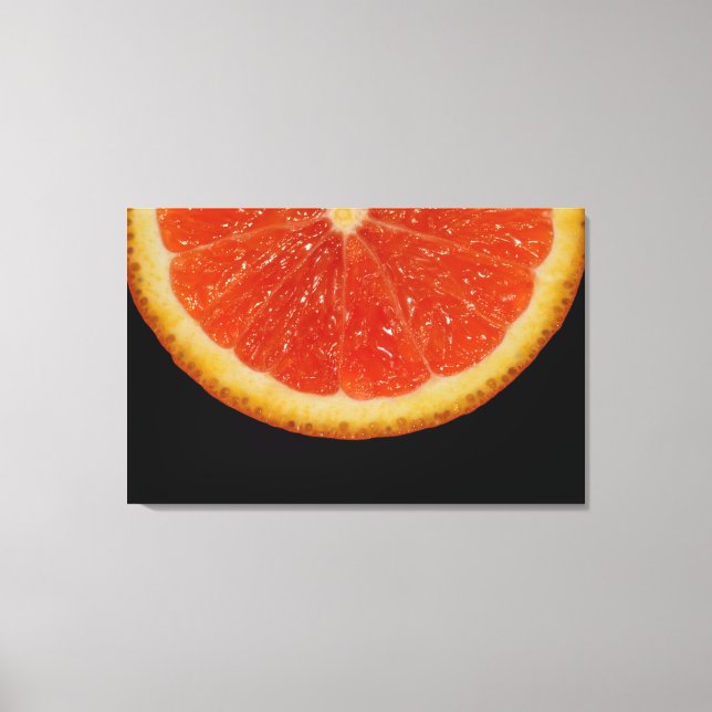 Orange slice on black canvas print (Front)