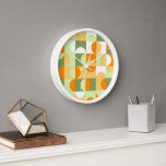 Orange Sunny Yellow Dark Green Retro Art Pattern Clock<br><div class="desc">Beautiful contemporary white, sunny yellow, orange, dark and light green coloured geometric circles and half circles pattern.. Elegant, stylish and eclectic minimalism design for the artistic interior designer, the artsy décor decorator, popular hip trendsetter, vintage retro art style or abstract digital geometric motif lover. Match this design with your interior...</div>