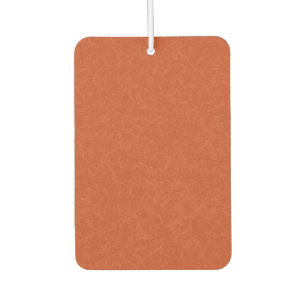 Orange textured surface with swirling pattern air freshener