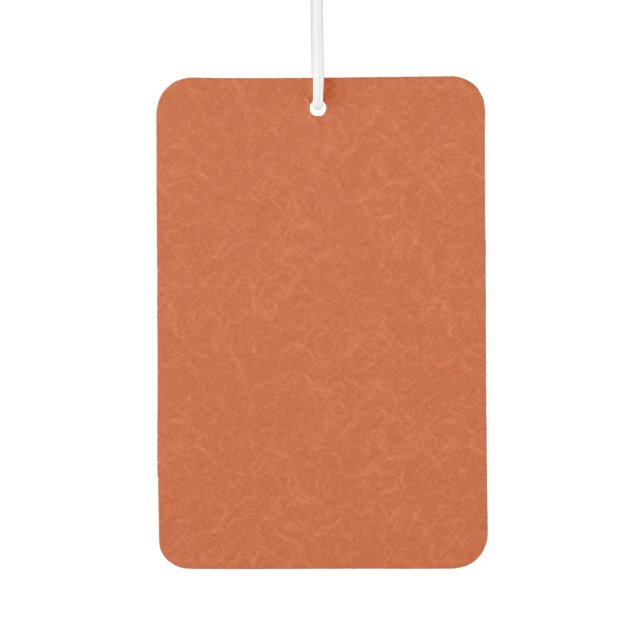 Orange textured surface with swirling pattern air freshener (Front)