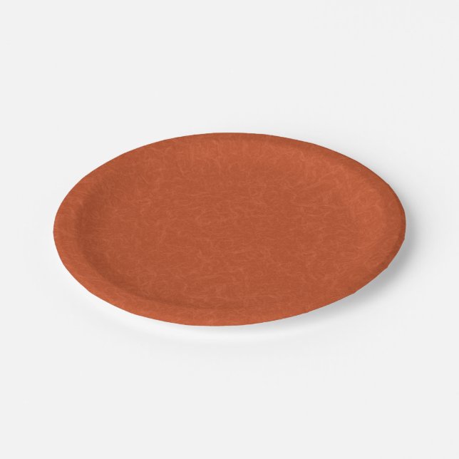 Orange textured surface with swirling pattern paper plate (Angled)