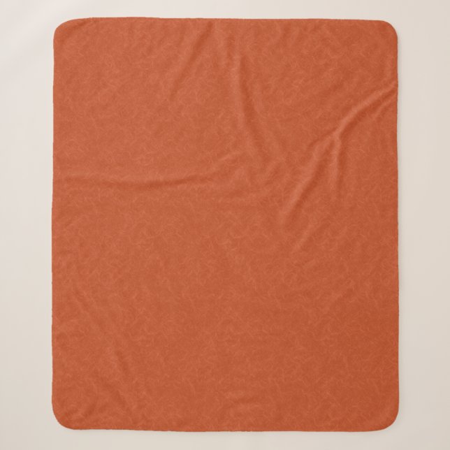 Orange textured surface with swirling pattern sherpa blanket (Front)