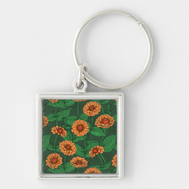 Orange Zinnia flowers, green leaves on dark green Keychain (Front)