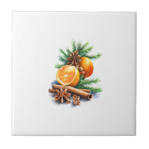 Oranges with Cloves and Cinnamon Next to Fir Leave
