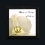 Orchid Flower on White Wedding Gift Box<br><div class="desc">Customize the pretty Orchid Flower on White Wedding Gift Box with the personal names of the bride and groom and marriage ceremony date to create a personalized keepsake gift for the newlyweds or a thank you gift for your wedding attendants, bridesmaids and bridal party. This elegant custom flowery trinket box...</div>