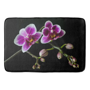 Orchid pink white colour on black pale gentle  bath mat