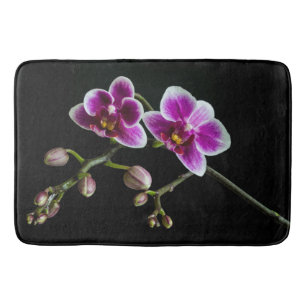 Orchid pink white colour on black pale gentle  bath mat