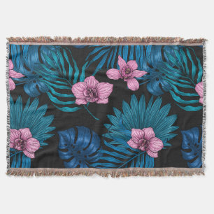 Orchids and palm leaves, pink and blue on black throw blanket