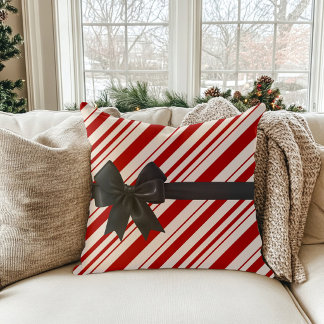 Oreiller de Noël rayé comme un bonbon avec un nœud