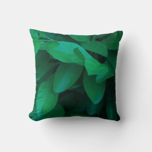 Oreiller jeté aux feuilles de plante vert pâle