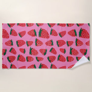 Organic summer strawberries red on pink background beach towel