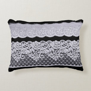 Ornamental white lace, isolated black background. accent pillow