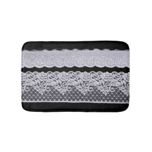 Ornamental white lace, isolated black background. bath mat