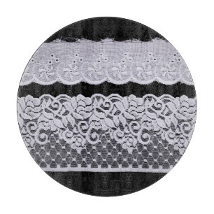 Ornamental white lace, isolated black background. cutting board